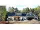 Charming single Gathering home with a mix of stone and vinyl siding and an attached two-car garage at 1025 Baylor Grv, Monroe, NC 28112