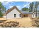 Charming home with a covered patio and well-maintained backyard at 1025 Baylor Grv, Monroe, NC 28112
