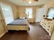 Charming bedroom with a rustic-style bed and hardwood floors at 212 Pethel St, Kannapolis, NC 28081