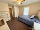 Cozy bedroom featuring hardwood floors and a comfortable bed at 212 Pethel St, Kannapolis, NC 28081