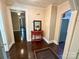 Entryway with dark hardwood floors and a red accent table at 212 Pethel St, Kannapolis, NC 28081
