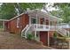 Red brick home with a white porch and steps at 212 Pethel St, Kannapolis, NC 28081