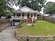 Brick house with a front porch and landscaped yard at 212 Pethel St, Kannapolis, NC 28081