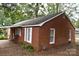 Red brick house with white trim and mature trees at 212 Pethel St, Kannapolis, NC 28081