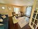 Bright living room with hardwood floors and two armchairs at 212 Pethel St, Kannapolis, NC 28081