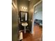 Stylish powder room with modern fixtures, a pedestal sink, and a convenient location at 4327 Kobuk Ln, Charlotte, NC 28269