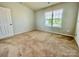 Bedroom with carpet, neutral walls, a window, and natural light at 4327 Kobuk Ln, Charlotte, NC 28269