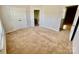 Bedroom featuring carpeted floors, neutral walls, closet, and a window at 4327 Kobuk Ln, Charlotte, NC 28269