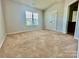 Carpeted bedroom with natural light, neutral paint, closet, and airy feel at 4327 Kobuk Ln, Charlotte, NC 28269