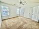 Bedroom with carpet, neutral walls, and natural light from two windows at 4327 Kobuk Ln, Charlotte, NC 28269