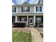 Charming townhome with well-kept front yard, stone accents, and inviting entrance at 4327 Kobuk Ln, Charlotte, NC 28269