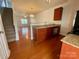 Kitchen featuring wood flooring, ample counter space, and plentiful cabinet storage at 4327 Kobuk Ln, Charlotte, NC 28269
