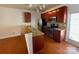 Well-lit kitchen with wood floors, stainless appliances, breakfast bar, and plenty of cabinets at 4327 Kobuk Ln, Charlotte, NC 28269