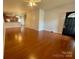 Spacious open-concept living space with beautiful hardwood floors and neutral paint palette at 4327 Kobuk Ln, Charlotte, NC 28269