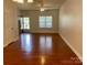 Bright, open-concept living room featuring hardwood floors and plenty of natural light at 4327 Kobuk Ln, Charlotte, NC 28269