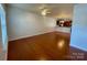 Open living area with hardwood flooring and ample natural light, perfect for entertaining at 4327 Kobuk Ln, Charlotte, NC 28269