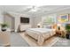 Staged bedroom with a modern bed, sleek furniture, and bright natural light at 5916 Bridger Ct, Charlotte, NC 28211