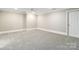 This bedroom features neutral paint and carpet at 5916 Bridger Ct, Charlotte, NC 28211