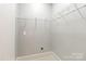 This closet includes wall racks and a peg board at 5916 Bridger Ct, Charlotte, NC 28211