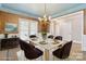 Sophisticated dining room featuring a chandelier, elegant table setting, and stylish decor at 5916 Bridger Ct, Charlotte, NC 28211