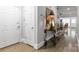 Inviting entryway with wood floors, decorative table and view into the living area at 5916 Bridger Ct, Charlotte, NC 28211