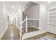 Hallway featuring hardwood floors, recessed lighting, stairs, and storage space at 5916 Bridger Ct, Charlotte, NC 28211
