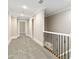 This hallway features neutral paint and carpet at 5916 Bridger Ct, Charlotte, NC 28211