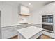 Well-appointed kitchen with quartz countertops, backsplash, and stainless steel appliances for modern cooking at 5916 Bridger Ct, Charlotte, NC 28211