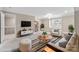 Living room with a modern aesthetic, featuring stylish furniture and bright natural light at 5916 Bridger Ct, Charlotte, NC 28211