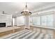 Spacious living room with hardwood floors, recessed lighting and lots of windows at 5916 Bridger Ct, Charlotte, NC 28211