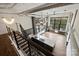 Open floor plan with kitchen island, hardwood floors, and large windows at 715 N Graham St # 201, Charlotte, NC 28202