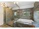 Modern bathroom with a walk-in shower and soaking tub at 715 N Graham St # 201, Charlotte, NC 28202