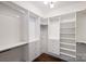 Large walk-in closet with ample shelving and drawers at 715 N Graham St # 201, Charlotte, NC 28202