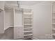 Spacious walk-in closet with ample shelving and drawers at 715 N Graham St # 201, Charlotte, NC 28202