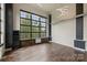 Bright dining room with hardwood floors and large windows at 715 N Graham St # 201, Charlotte, NC 28202