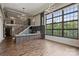 Modern kitchen with large island, stainless steel appliances, and exposed brick wall at 715 N Graham St # 201, Charlotte, NC 28202