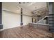 Open living area with hardwood floors and large windows at 715 N Graham St # 201, Charlotte, NC 28202