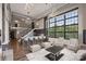 Open living room with modern kitchen and high ceilings at 715 N Graham St # 201, Charlotte, NC 28202
