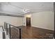 Spacious loft area with hardwood floors and modern lighting at 715 N Graham St # 201, Charlotte, NC 28202