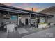 Rooftop terrace with an outdoor kitchen, fireplace, and city views at 715 N Graham St # 201, Charlotte, NC 28202
