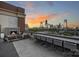 Enjoy city skyline views from this rooftop deck with fireplace and seating at 715 N Graham St # 201, Charlotte, NC 28202