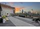 Rooftop deck with city views, fireplace, and comfortable seating at 715 N Graham St # 201, Charlotte, NC 28202