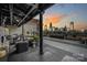 Relaxing rooftop terrace with fireplace and stunning city skyline views at 715 N Graham St # 201, Charlotte, NC 28202