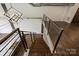 Modern staircase with metal railing and exposed brick at 715 N Graham St # 201, Charlotte, NC 28202