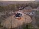 Aerial view of a charming home nestled in a wooded area at 3001 Sparrow Springs Rd, Gastonia, NC 28052