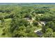 Wide aerial view of homes situated in a lush, green landscape at 3001 Sparrow Springs Rd, Gastonia, NC 28052