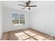 Bright bedroom featuring hardwood floors and a large window at 3001 Sparrow Springs Rd, Gastonia, NC 28052