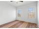 Spacious bedroom with hardwood floors, ceiling fan and two large windows at 3001 Sparrow Springs Rd, Gastonia, NC 28052