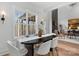Elegant dining room with a black table, gray chairs, and a view to the living room at 3001 Sparrow Springs Rd, Gastonia, NC 28052