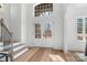 Light-filled entryway with double doors and hardwood flooring at 3001 Sparrow Springs Rd, Gastonia, NC 28052